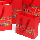 Les sacs de papier enduits stratifiés de cadeau avec l'ODM d'OEM de poignées ont soutenu